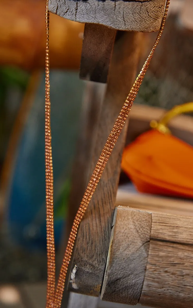 Collier long à strass style ambre et franges