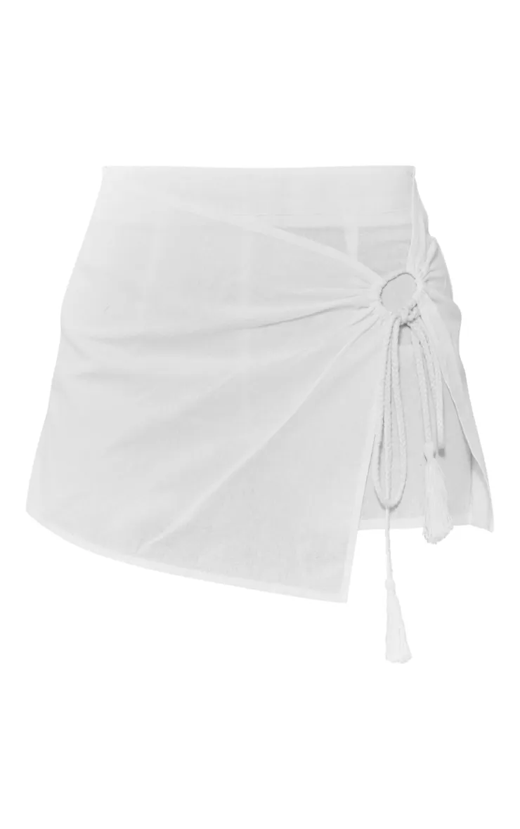 Jupe-short effet lin blanche à franges et anneau devant